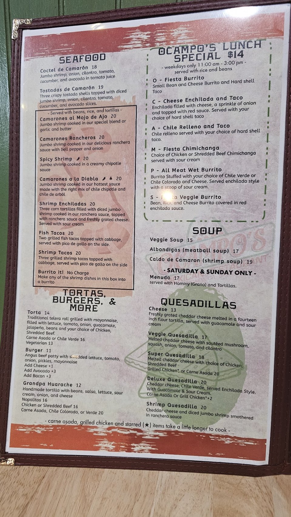 Menu board listing Mexican breakfast dishes.